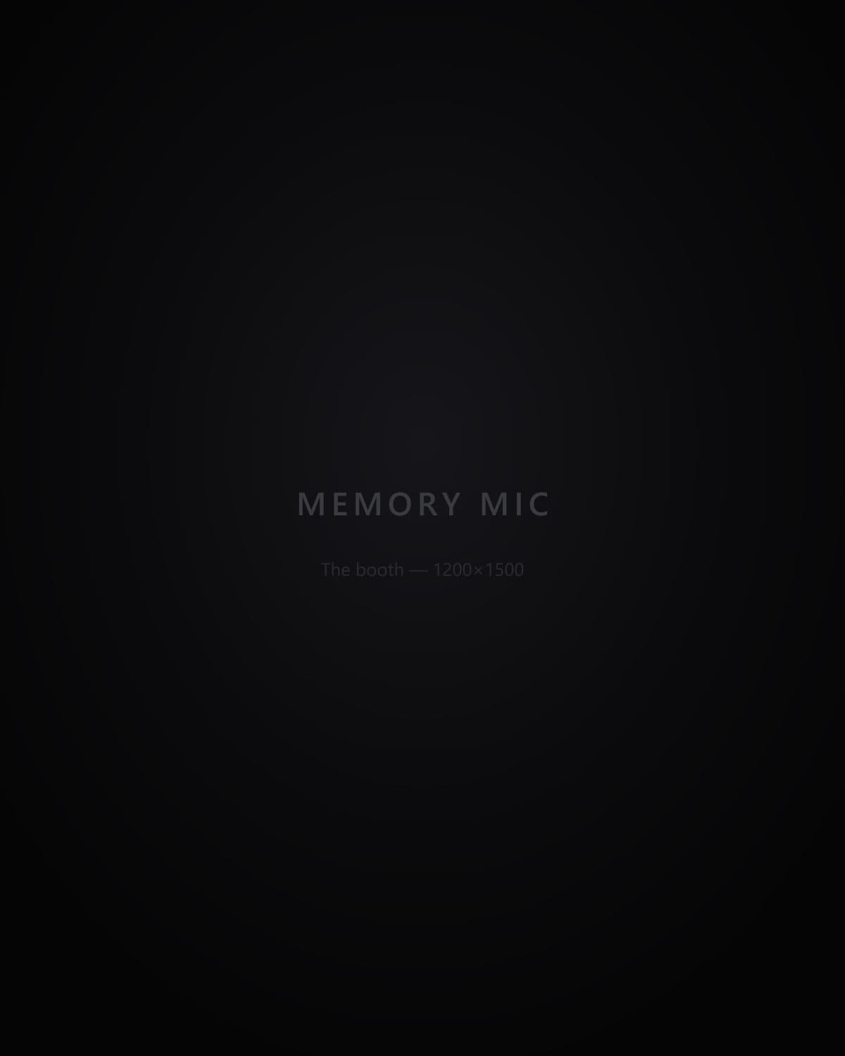 The Memory Mic booth standing in low light at an evening reception.